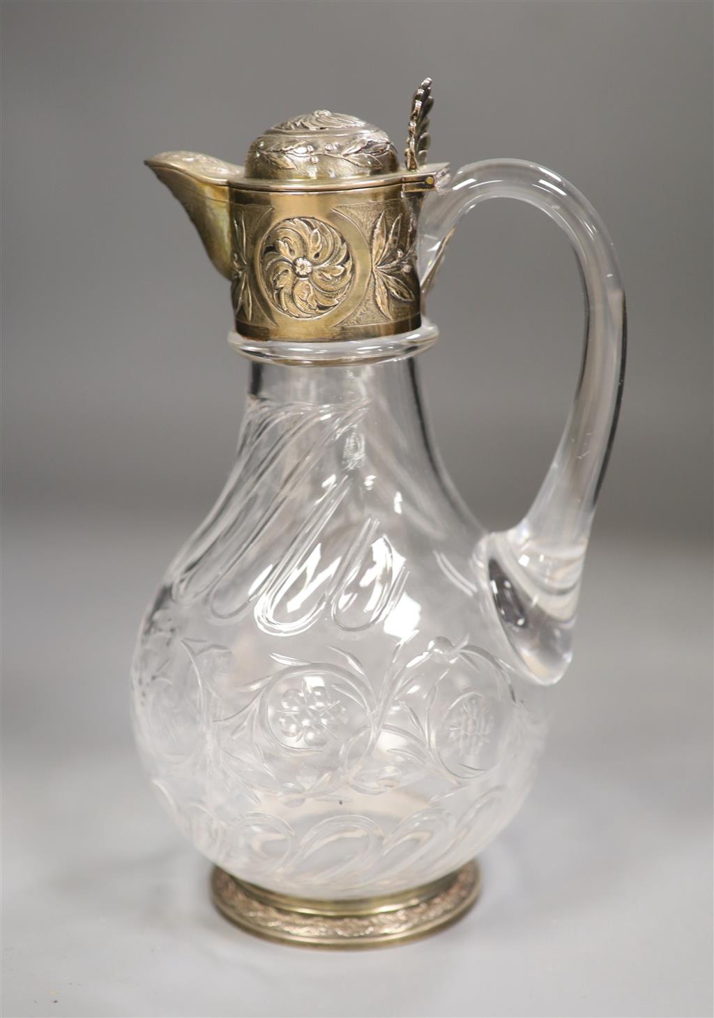 An early 20th century French white metal mounted glass claret jug, maker AL, height 23cm.
